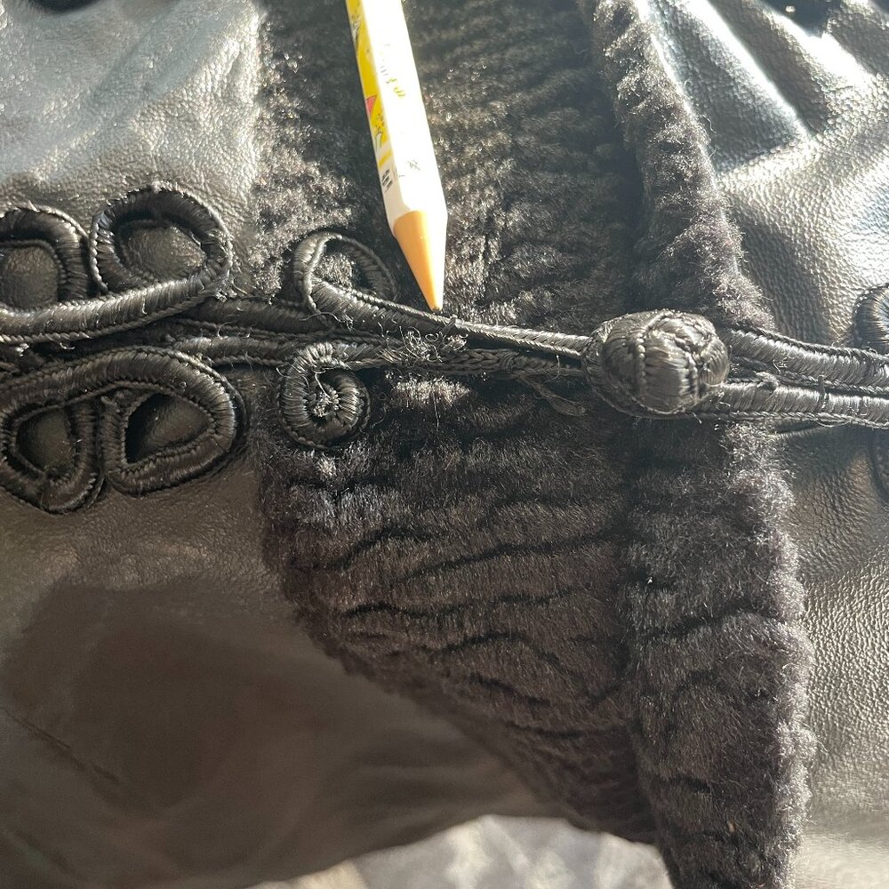 Leather jacket with embroidered buttons